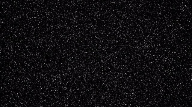 Slow motion of real white dust particles floating in a black background. Ideal for overlays and atmospheric effects