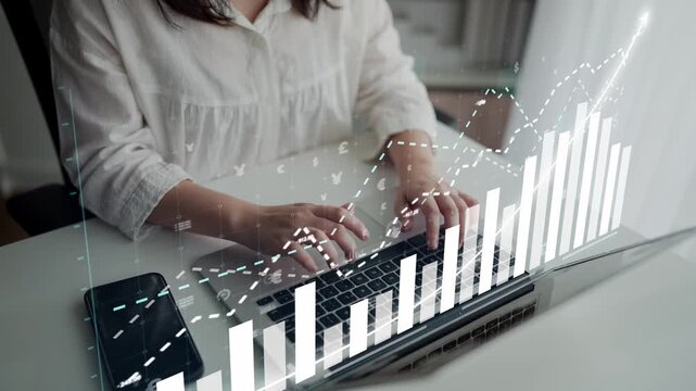 A businesswoman types on her laptop in a modern office, surrounded by digital data and financial graphs, exemplifying digital trends in analytics and productivity. Copula