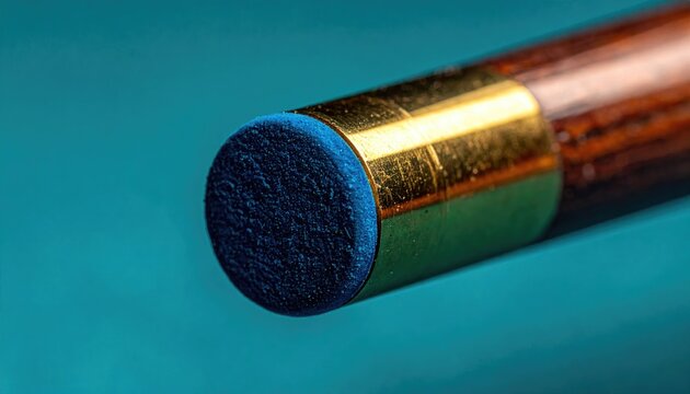Macro shot of a billiards cue tip against teal felt