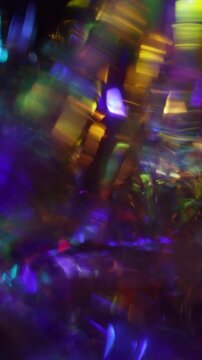 Crystal light rainbow holographic live vertical holiday dark background motion neon blue purple gold colors glow