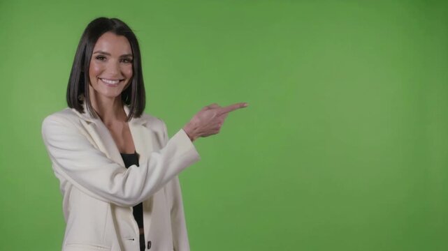 Woman in Business Suit Points Right on Green Screen Background