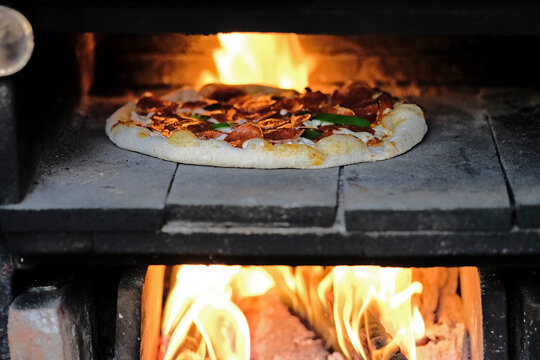 Home made pizzas on a wood fired oven