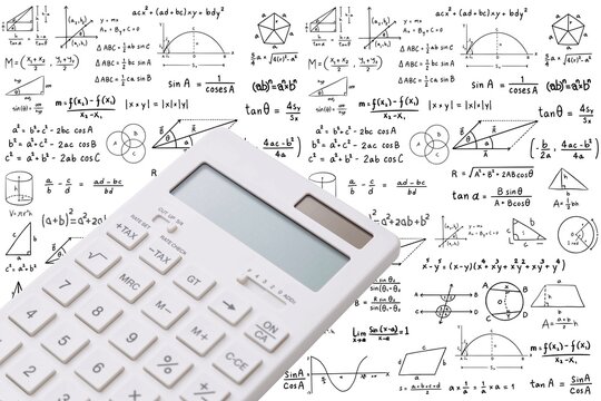 White electronic calculator on white background with math and trigonometry formulas sketches. Education, finance and accounting concept.