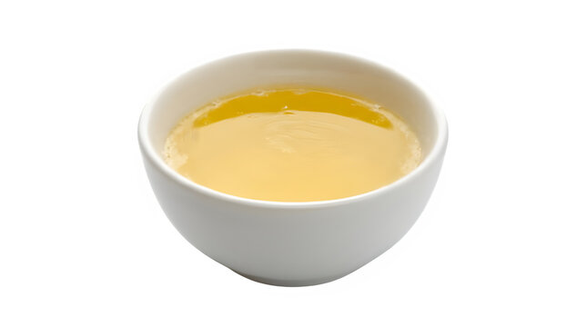 Liquid butter in a round bowl isolated on transparent background 