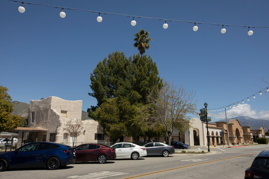 A string of lights frames buildings in historic downtown San Jacinto, California, USA.
