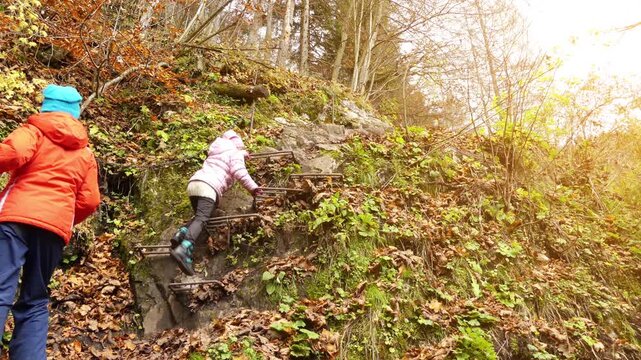 Two little beautiful girls walk in Slovak Paradise. Slovak Paradise (Slovensky raj) is mountain range in eastern Slovakia, part of Spis-Gemer Karst, located between towns of Spisska Nova Ves.