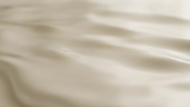 Fluid milky substance in slow motion creating abstract wavy patterns and soft surface texture background