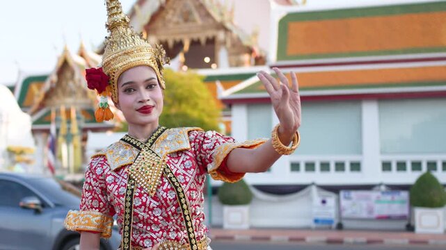 Traditional Thai Khon Dancer Performing in Front of Temple