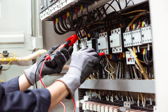 Electrical engineering maintenance and troubleshooting with digital measuring equipment.