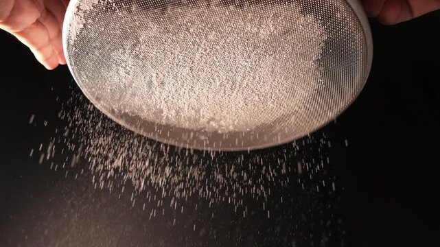 Sifting Flour Through Fine Mesh Sieve in Slow Motion Baking Preparation