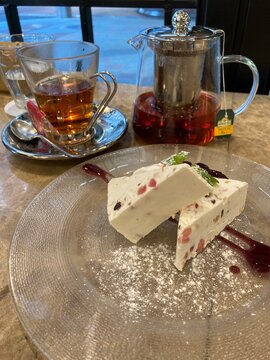 Italian cassata cake dessert served with hot black tea in a cafe⁠ 