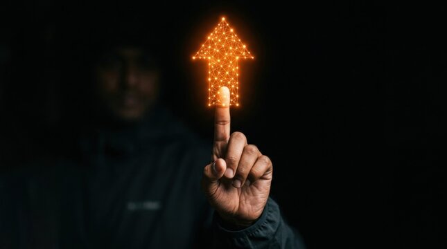 Hand person pointing upwards glowing orange Sales enablement programs enhance effectiveness by combining strategic content