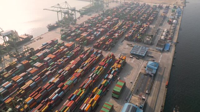 Aerial View of a Busy Shipping Port Terminal with Multi-Colored Cargo Containers