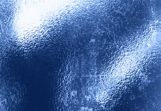 Dark blue icy texture with frosted diagonal highlights, rough grain, subtle scratches, and snot like speckles for moody design backgrounds.