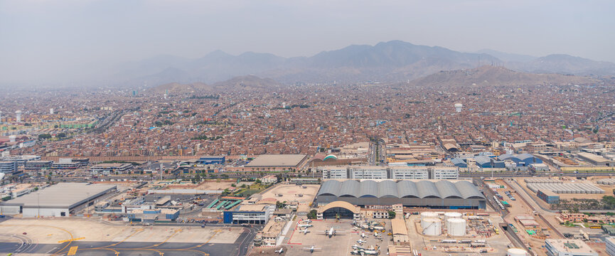 Aerial view of Lima city and Jorge Chavez International Airport with Andes Mountains in Peru