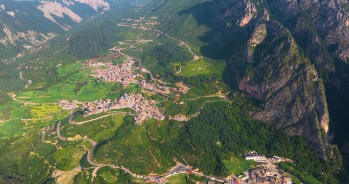 Panoramic view of Zhagana village in morning mist, Gannan Gansu, natural scenery of mountain valley with Tibetan settlements	
