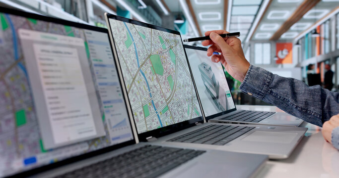 Woman Urban Planner Analyzes City Land Maps On Laptop