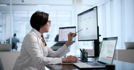 Healthcare Manager Analyzes Medical Billing Codes On Laptop