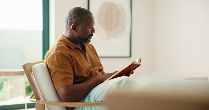 Relax, black man and reading book in home with smile, calm and literature on weekend break. Novel, study or mature person on armchair at living room with fiction story, information or knowledge hobby