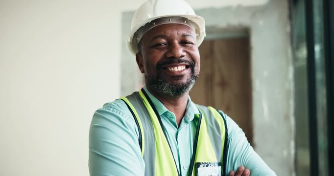 Architect, face and happy man with arms crossed on construction site, real estate or home renovation. Mature civil engineer, portrait and black person with helmet, confident and architecture in Kenya
