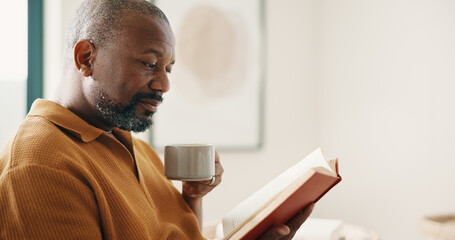 Fototapeta premium Relax, coffee or black man in home with reading book, calm moment or literature hobby on weekend break. Chill, space or mature person with warm drink, fantasy story or peaceful activity on day off.