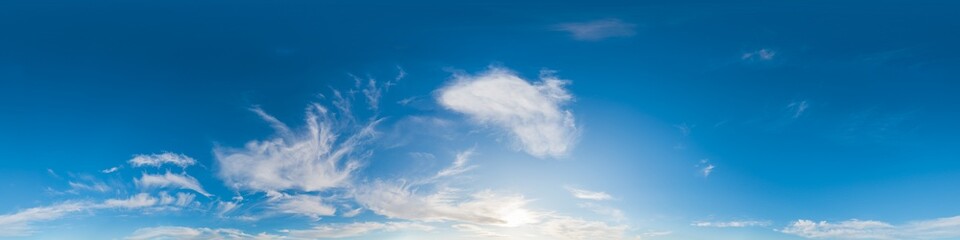Obraz premium Sky clouds panorama showing wide blue atmosphere with wispy white formations and gentle sunlight for serene background