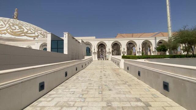 A sunlit dome and ornate interiors of Sheikh Khalifa Bin Zayed Al Nahyan Mosque in Al Ain City radiate grandeur