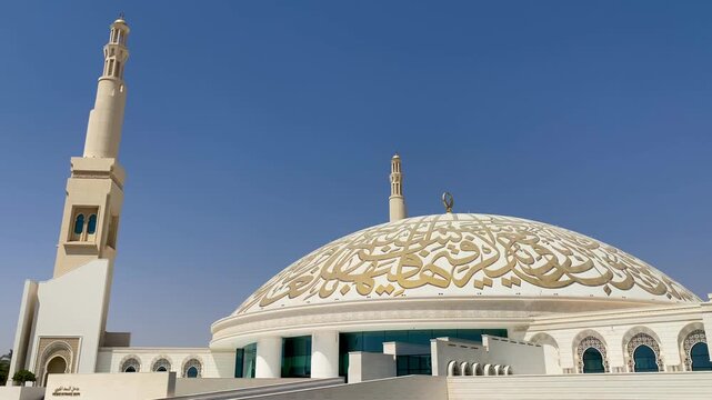 Majestic ornate archway with hanging lantern inside Sheikh Khalifa Bin Zayed Grand Mosque, Al Ain, Abu Dhabi.