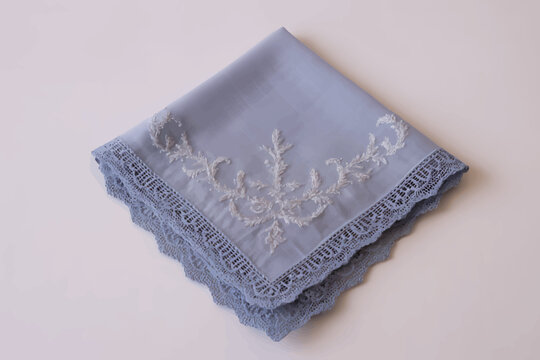 Folded Light Blue Handkerchief with White Embroidery