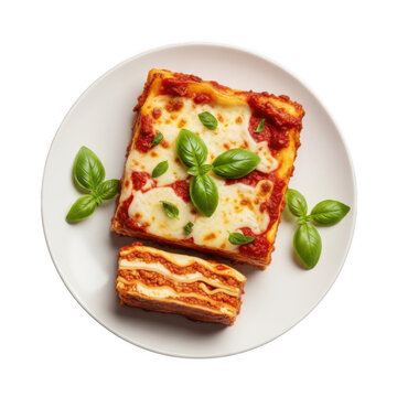 Fresh delicious lasagna slice with cheese and basil on plate isolated on transparent background