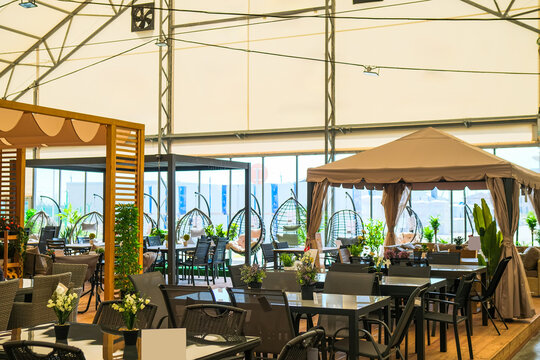 Outdoor restaurant terrace with city view.