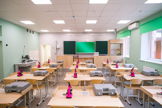 Empty science classroom with microscopes.