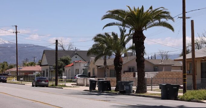 Palm trees frame a neighborhood near downtown San Jacinto, California, USA.