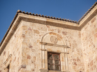 Naklejka premium Old building facade with stone wall and window