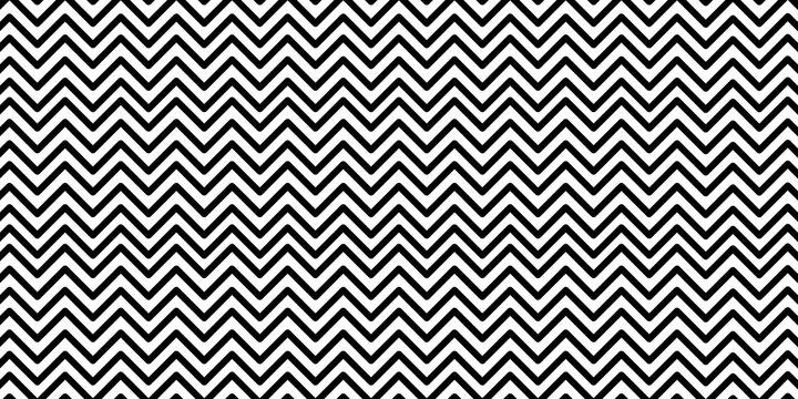 Black and white seamless chevron zigzag pattern background, modern geometric textile design, repeating monochrome abstract texture with bold graphic style.