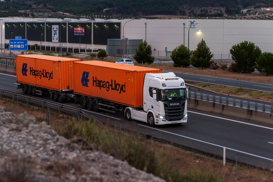 Ontigola, Toledo, Spain, 6/24/2026: Hapag Lloyd container duo-trailer traveling on Spanish highway