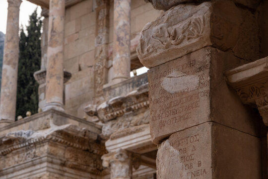 Full frontal view of the ancient Library of Celsus showcasing its intricate stone masonry and aediculae.