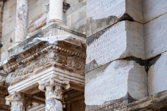 The majestic front elevation of the Library of Celsus ruins under daylight in the ancient city of Ephesus.