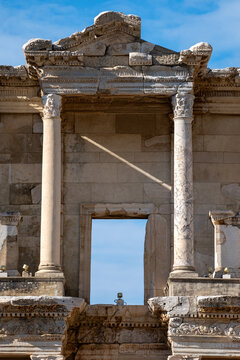 Symmetrical front view of the ancient Library of Celsus ruins showing composite and Corinthian architectural orders.