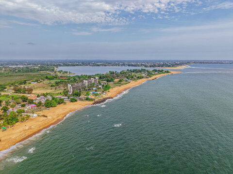 Aerial view of the historic ruins of the Ducor Hotel overlooking the Atlantic Ocean and a lagoon, Monrovia, Liberia.