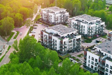 Fototapeta premium Modern condominiums near forest in quiet residential district