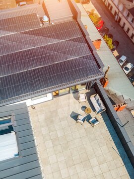 Urban home rooftop terrace with solar energy panels