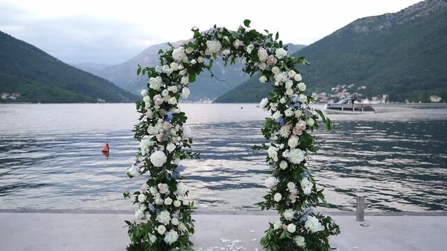 Peaceful lakeside environment featuring white rose arch and gentle ripples