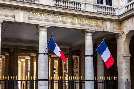 Paris, France - June 17, 2026: Portico decked with french flags at the entrance of the Constitutional Council, the highest constitutional authority in France, located in the Palais Royal.