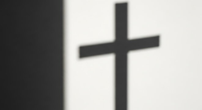 Blurred christian cross symbol on a black and white minimalist background