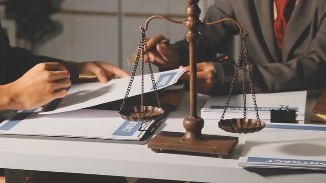 Lawyer explained to the client about the law that must be brought against the court case.Lawyer explained to the client about the law that must be brought against the court case.