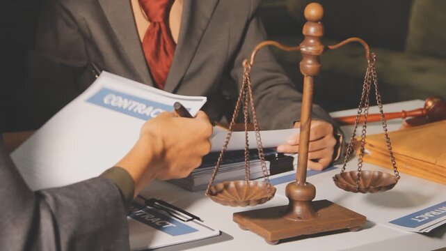 Lawyer explained to the client about the law that must be brought against the court case.Lawyer explained to the client about the law that must be brought against the court case.