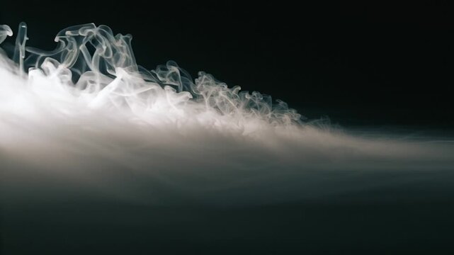 Diffuse gray smoke forms gentle layered trails with soft airy transparency and subtle fading glow. Light haze effect for cinematic overlays. Gray smoke overlay effect cloud design