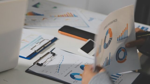 Accounting company provide finance and taxation planning for profitable cash flow, Auditor and accountant team working in office, analyze financial data and accounting record with calculator.Insight