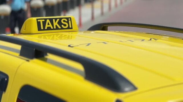 Yellow taxi roof sign on a modern cab. Urban transportation, taxi service, public mobility, city travel, commuting and passenger transport concept.